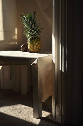 Pineapple on table at home