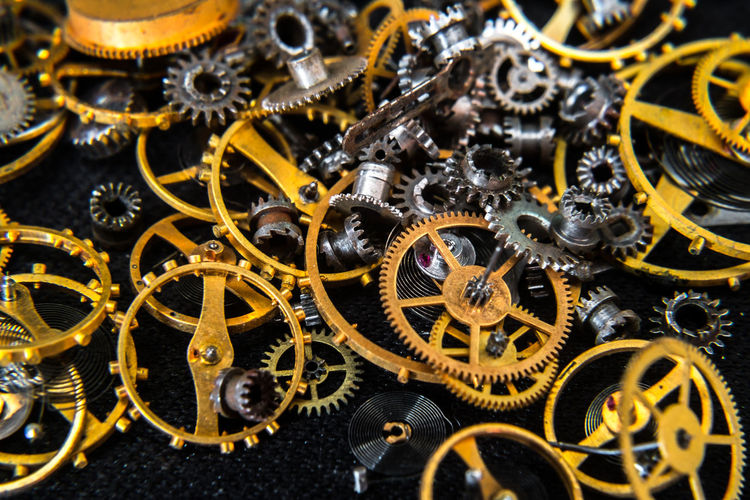 Close view of a vintage toothed wheels watch mechanism with jewels