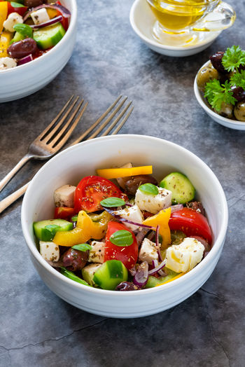 Traditional greek salad with fresh vegetables and feta cheese - healthy food idea