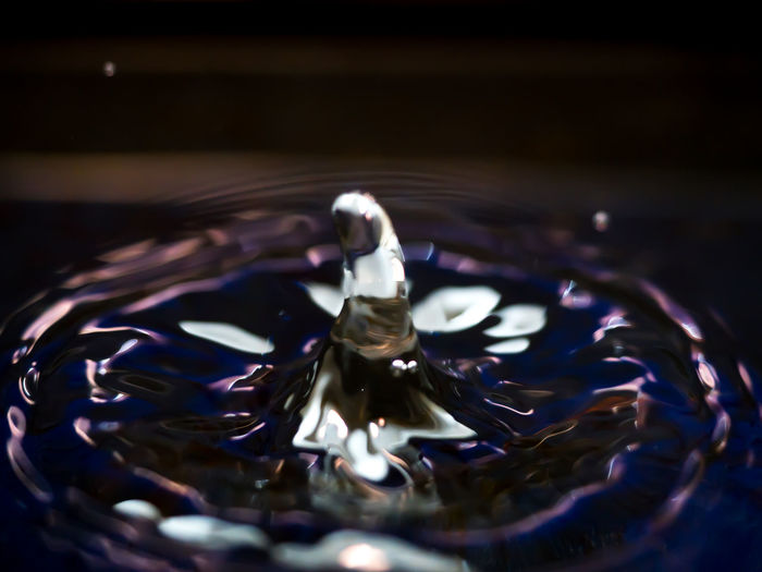 Close-up of water drop on glass