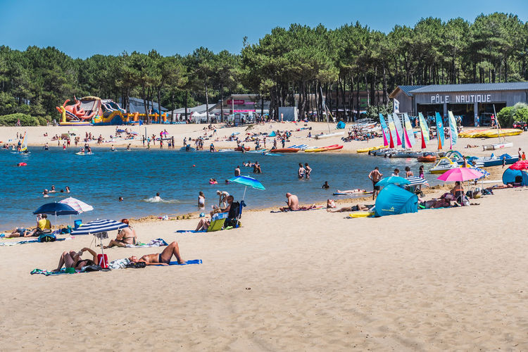 Group of people relaxing on beach