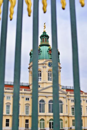 Palace behind steel fence