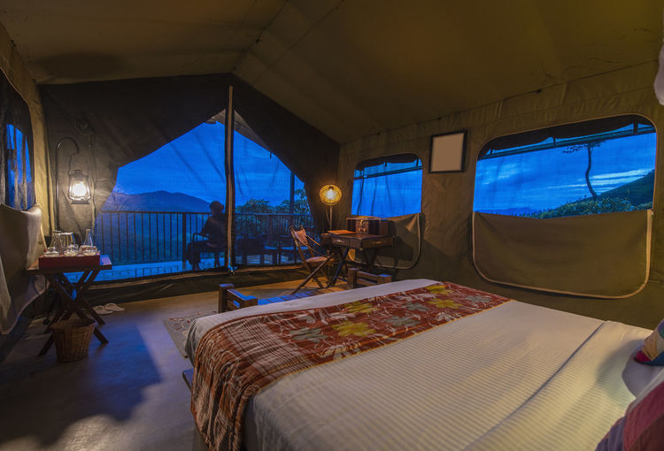 Bedroom inside of a luxury camp on the sri lankan highlands