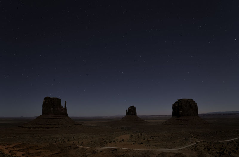 Scenic view of rock formations at night
