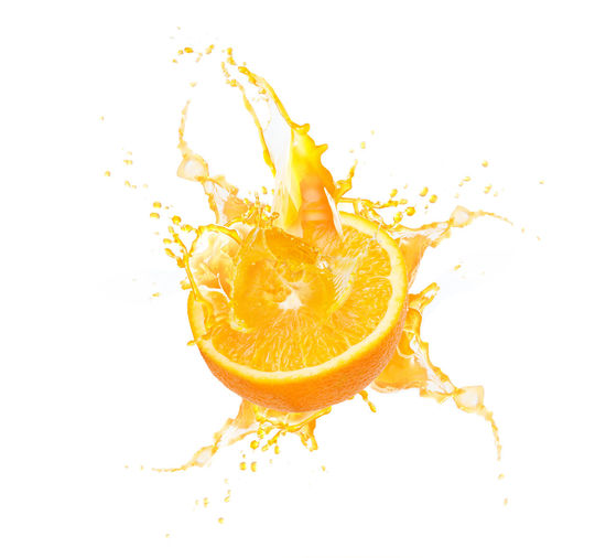 Close-up of orange fruit on white background