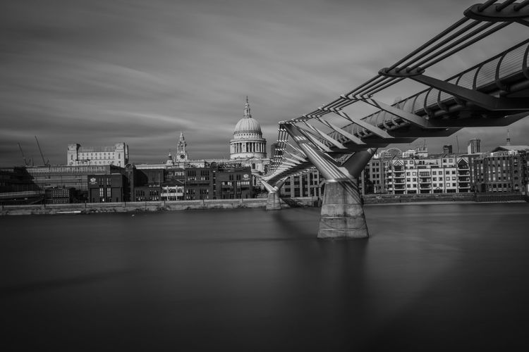 London millennium footbridge over thames river against st paul cathedral