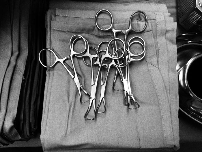 High angle view of surgical instruments on towel