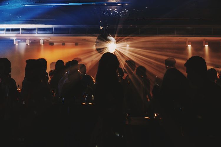 Silhouette people in nightclub 