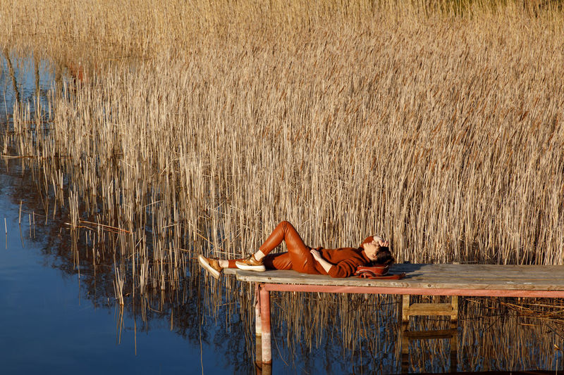 Woman lying down in water