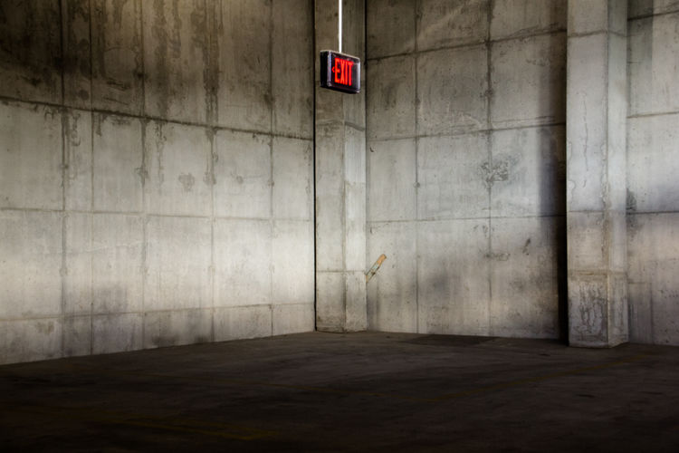 Illuminated exit sign on wall