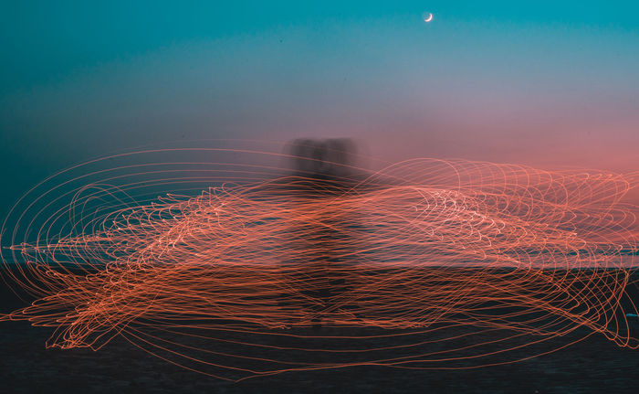 Light painting against sky during sunset