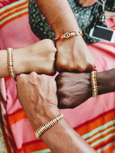Midsection of woman holding hands
