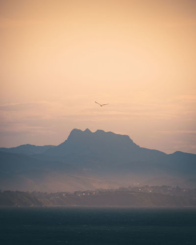 Scenic view of mountains against sky during sunset in biarritz