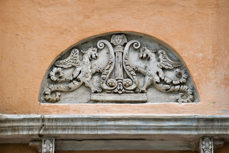 Low angle view of carving on wall of historic building
