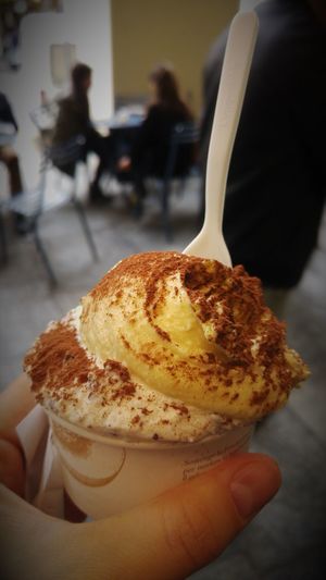 Close-up of hand holding ice cream