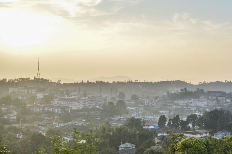 High angle view of coorg against sky during sunset