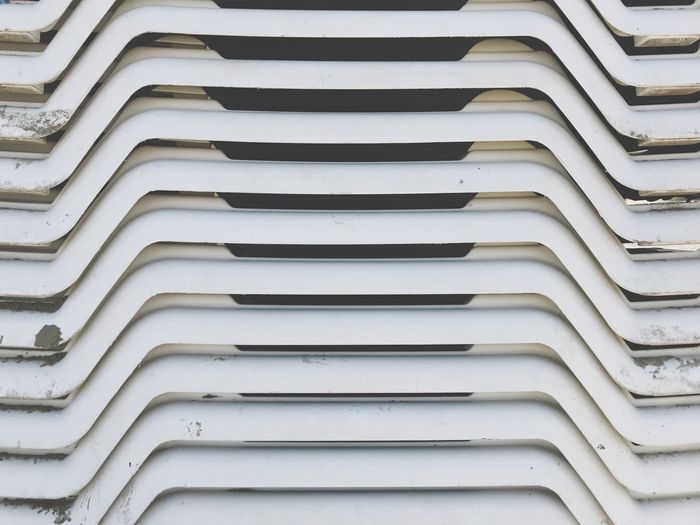 Full frame shot of stacked chairs