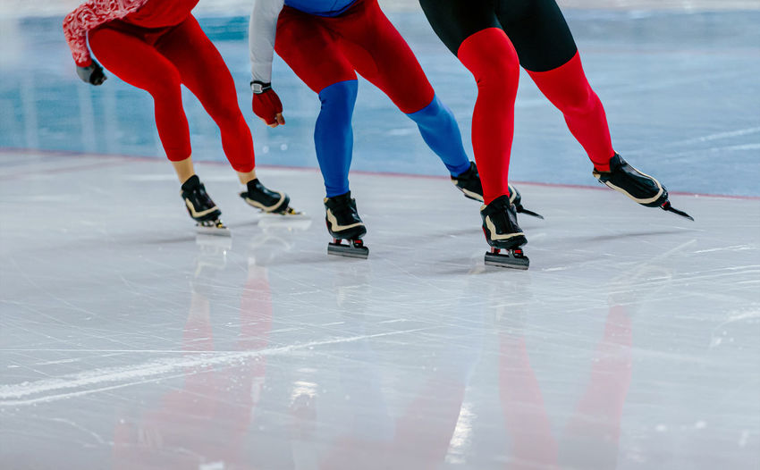Group male speed skaters at speed skating competition
