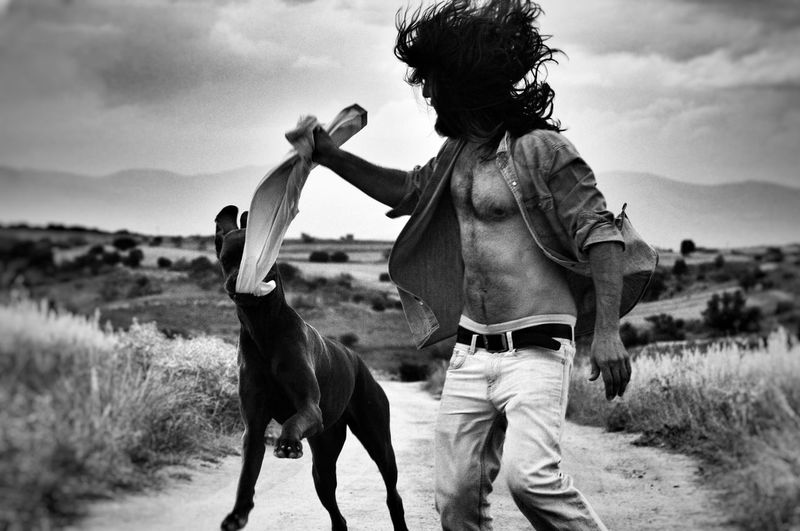 Man playing with dog