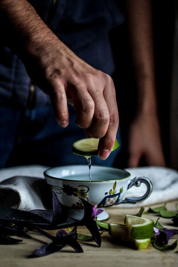 Close-up of man preparing tea