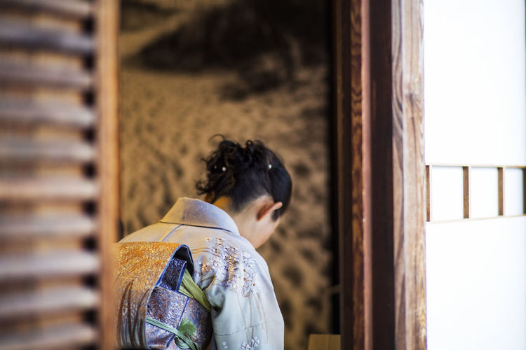 Woman praying in japanese temple