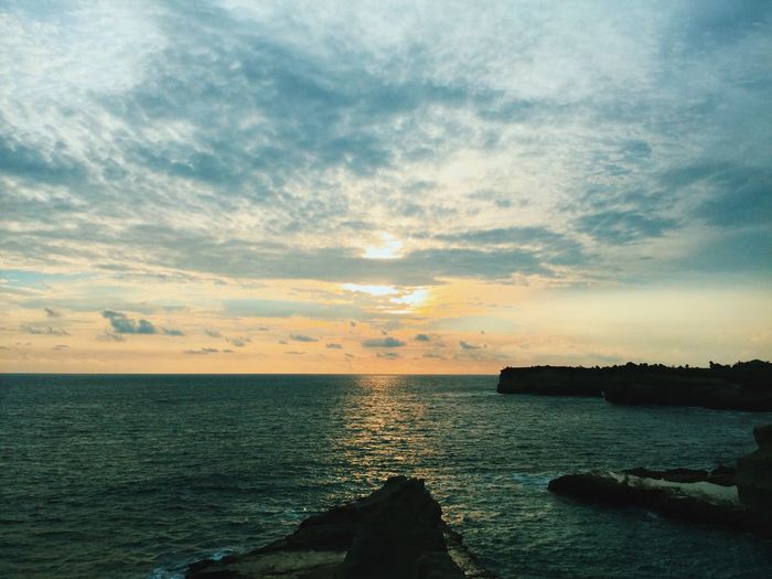 Scenic view of sea at sunset