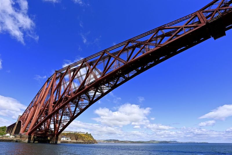 Firth of forth rail bridge over river against sky