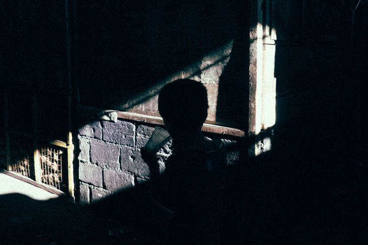 Rear view of silhouette boy