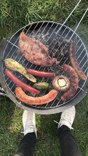 Low section of person on barbecue grill