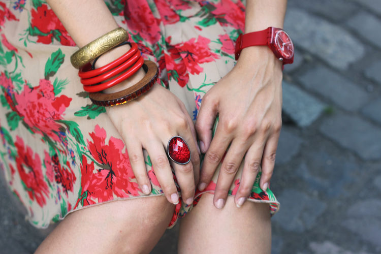 Midsection of woman wearing ring and bangles