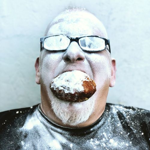 Close-up of man eating food