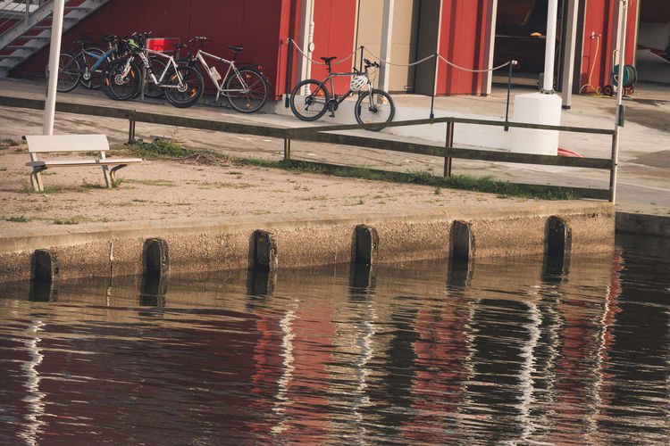 Bicycles parked by water