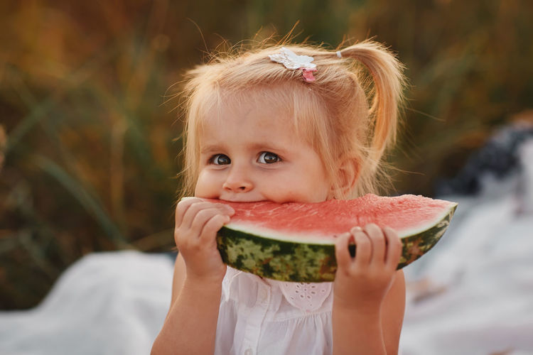Close-up of girl eating watermelon