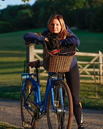 Portrait of young woman on bicycle