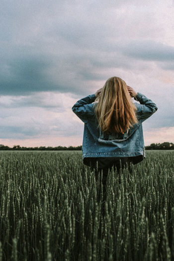 Rear view of a woman in the field