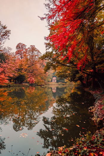 Lake with neoclassical temple in the park of monza during the autumn foliage