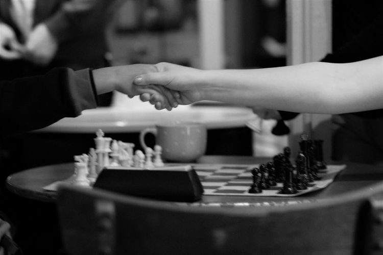 Close-up of hands playing on table