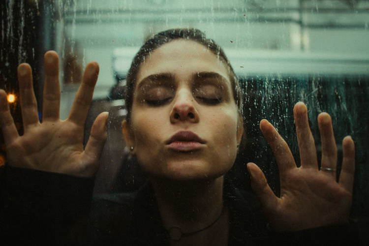 Through the glass EyeEm Of The Week The Week On EyeEm Beautiful Woman Close-up Front View Human Face Lifestyles Portrait Real People Wet Young Adult Young Women