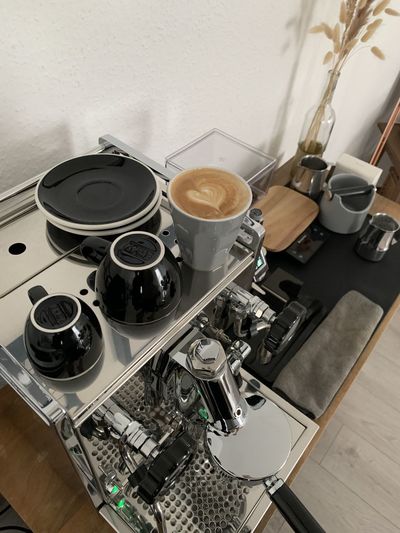 High angle view of coffee cups on table
