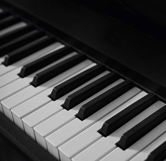 Abstract closeup shot of piano keyboard in studio