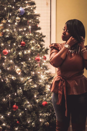 Woman looking at christmas tree