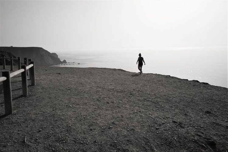 Full length of a man walking on beach