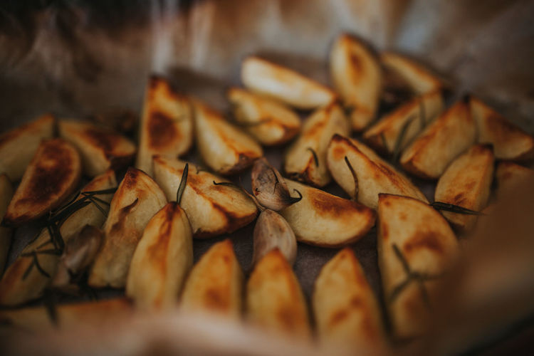 Close-up of roasted potatoes on table