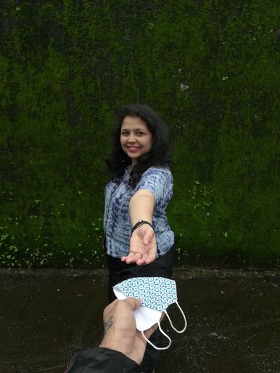 Portrait of a smiling young woman standing outdoors