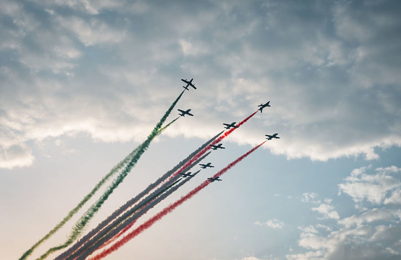 Low angle view of airshow against sky