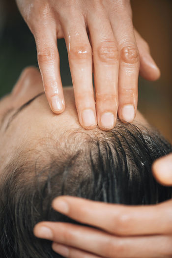 Woman enjoying ayurvedic oil treatment for healthy hair