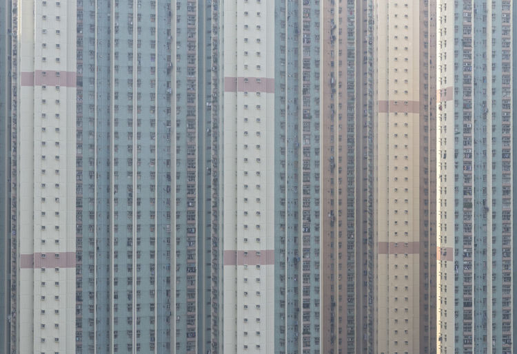 Low angle view of illuminated buildings against sky in city