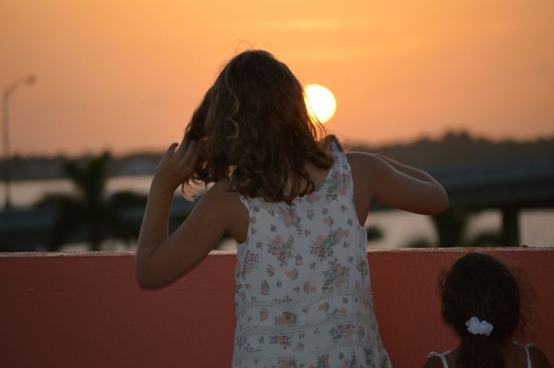 Woman looking at sunset