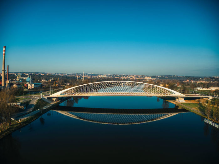View of bridge over river in city