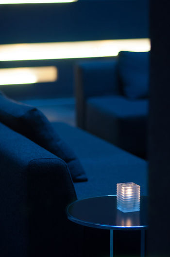 Lighting equipment on table by sofa